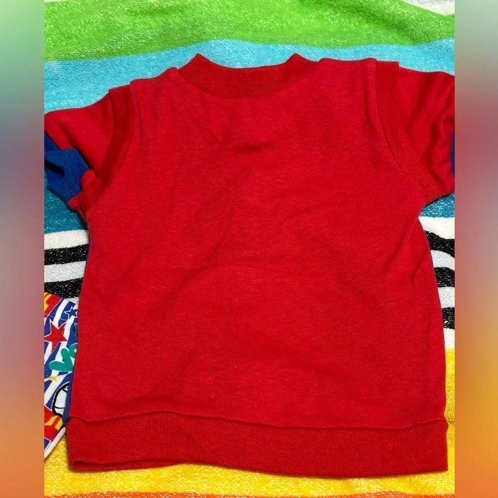 Cute beach volleyball shirt & short set by Cuties by Judy. Size 6-9 months. New!